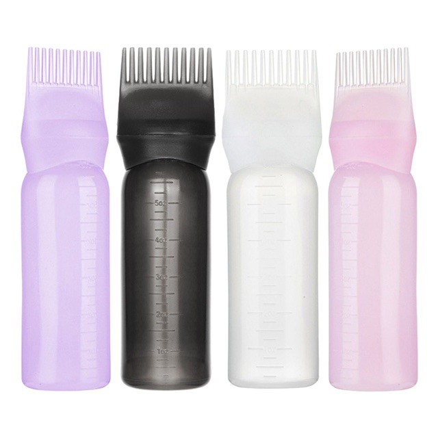 Oil applicator bottle with comb